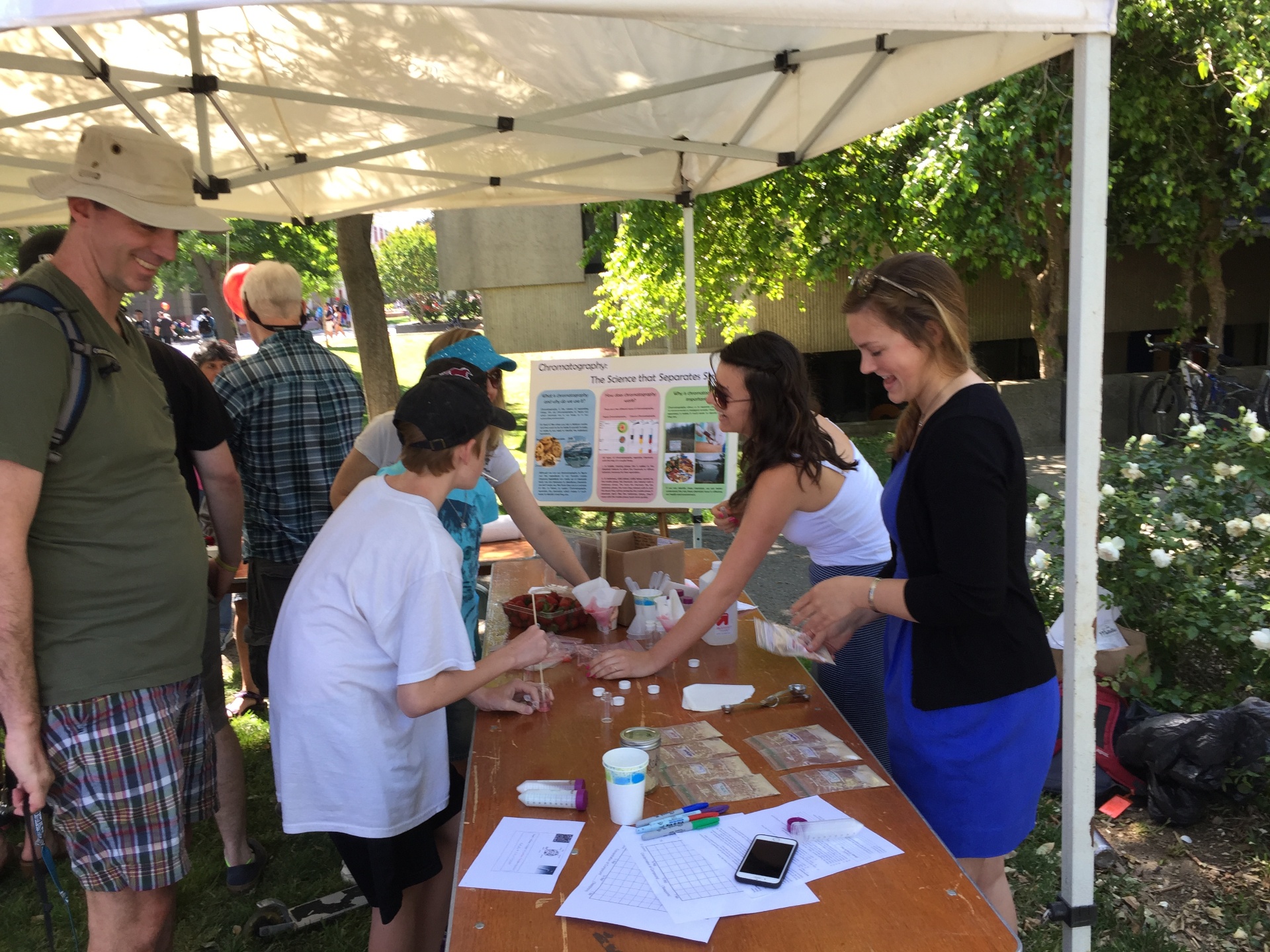 SRP researchers engaging with the community at an outdoor science outreach event