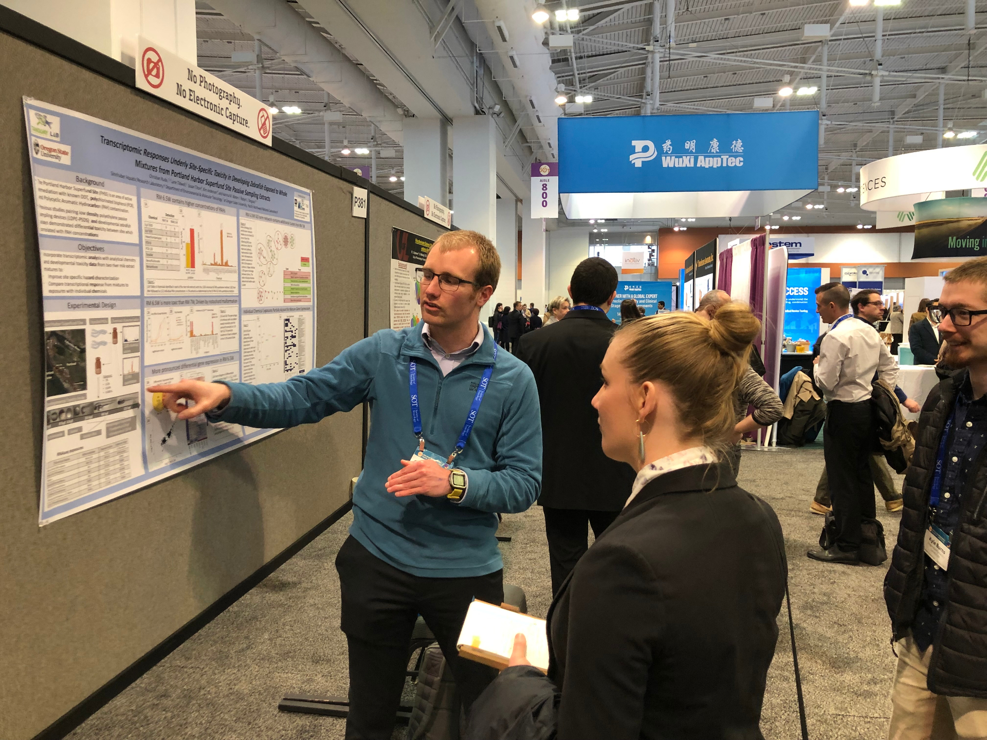 Researcher pointing to data on a Portland Harbor Superfund poster